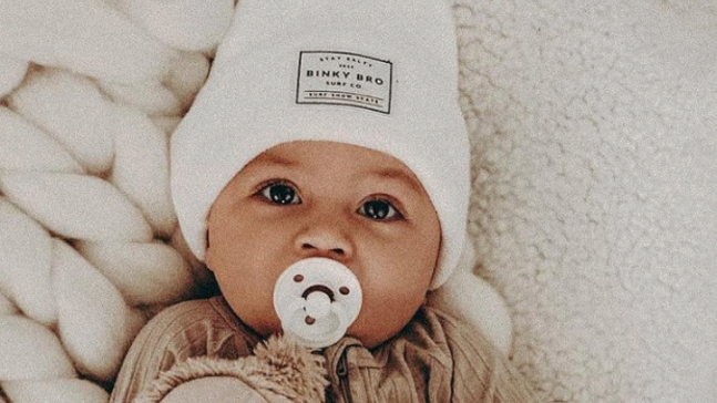baby with white styled beanie