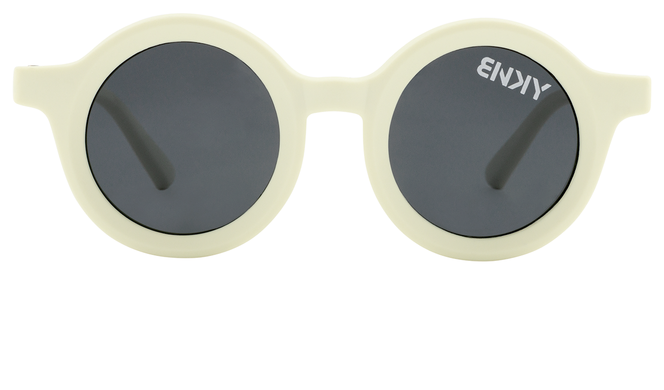 Stylish round sunglasses in bone color with dark lenses, perfect for kids embracing a surf-snow-skate lifestyle.