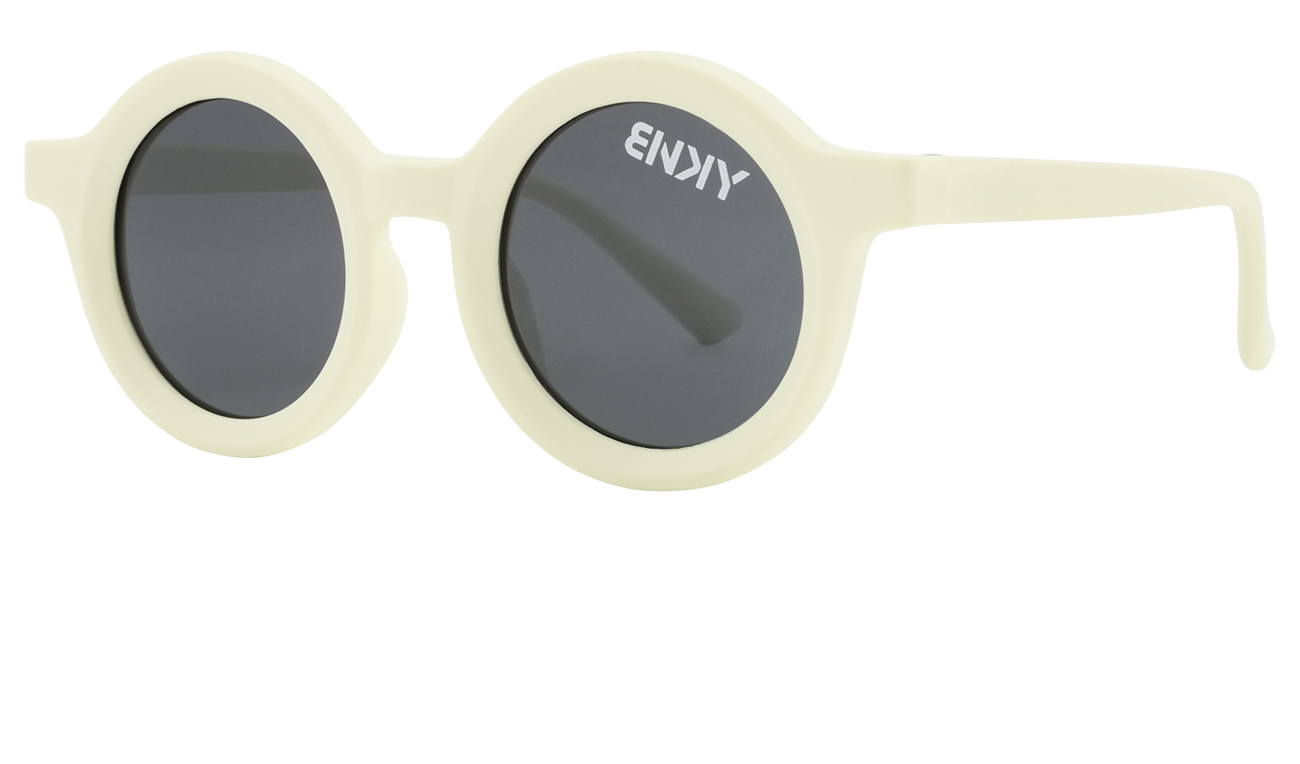 Stylish bone-colored round sunglasses with dark lenses, perfect for kids' outdoor adventures. Ideal for a surf-snow-skate lifestyle.