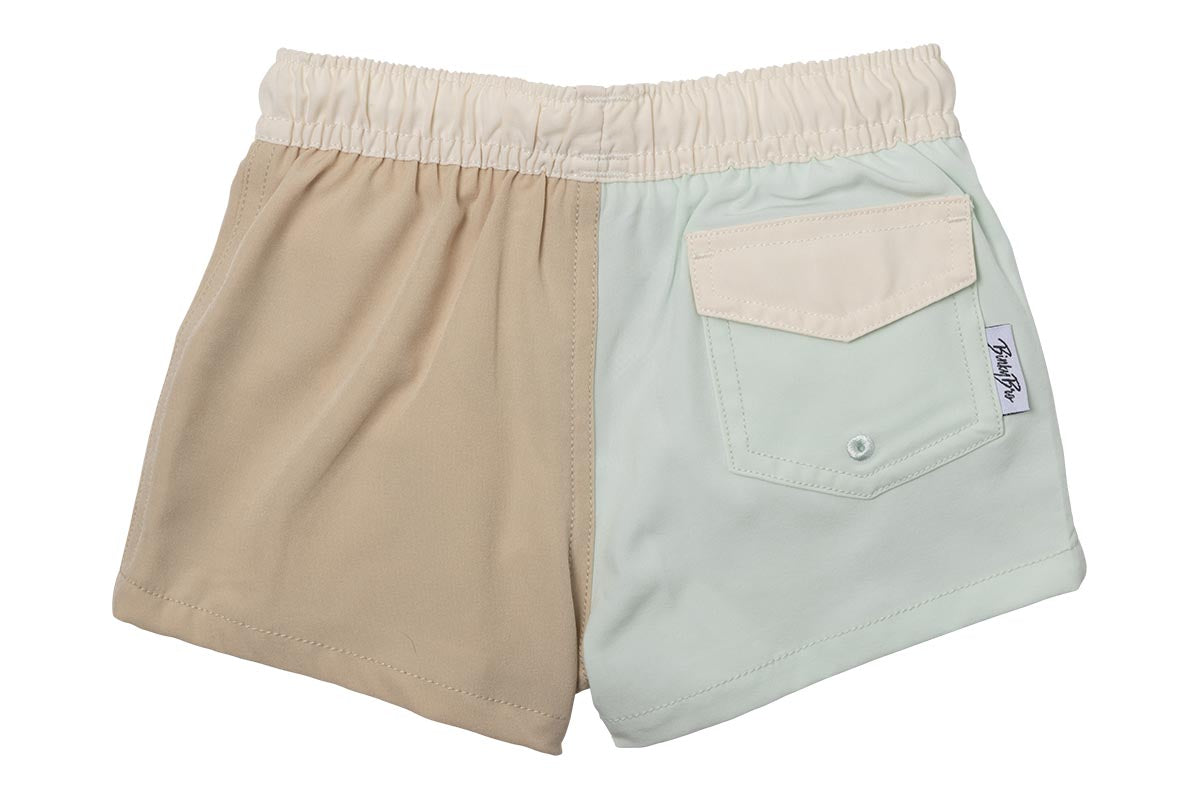 Stylish two-tone swim shorts for kids featuring an elastic waistband and a back pocket, perfect for beach days.