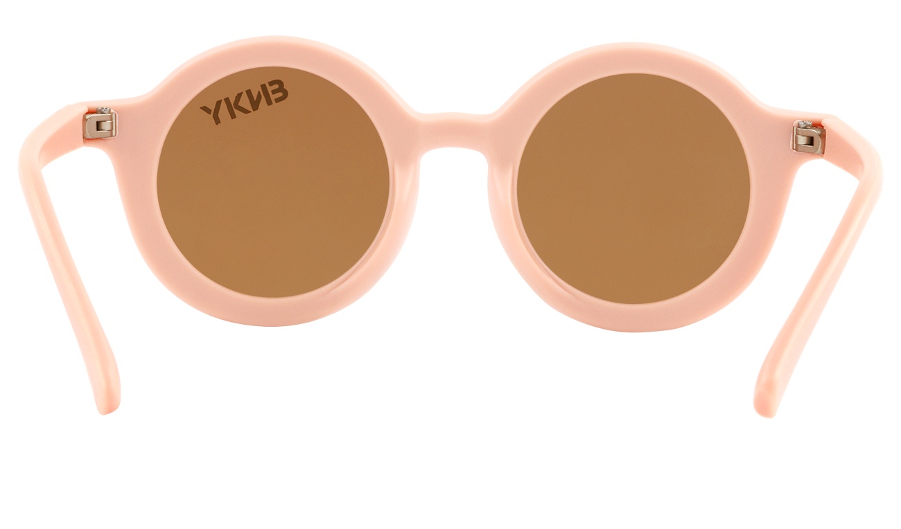 Stylish peach round sunglasses with brown lenses, perfect for kids' outdoor adventures and sun protection.
