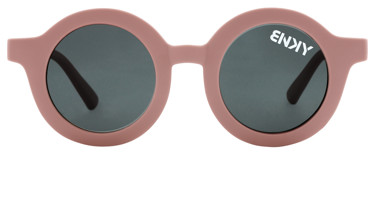 Vintage round sunglasses in soft pink with dark lenses and a stylish logo on the frame, perfect for trendy kids.