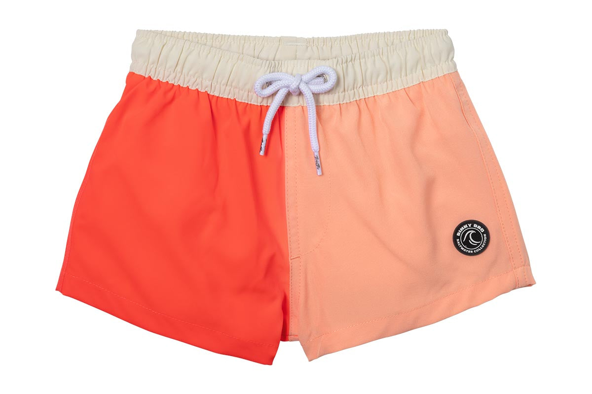 Stylish two-tone swim shorts for kids in vibrant coral and peach, featuring an adjustable drawstring waist.