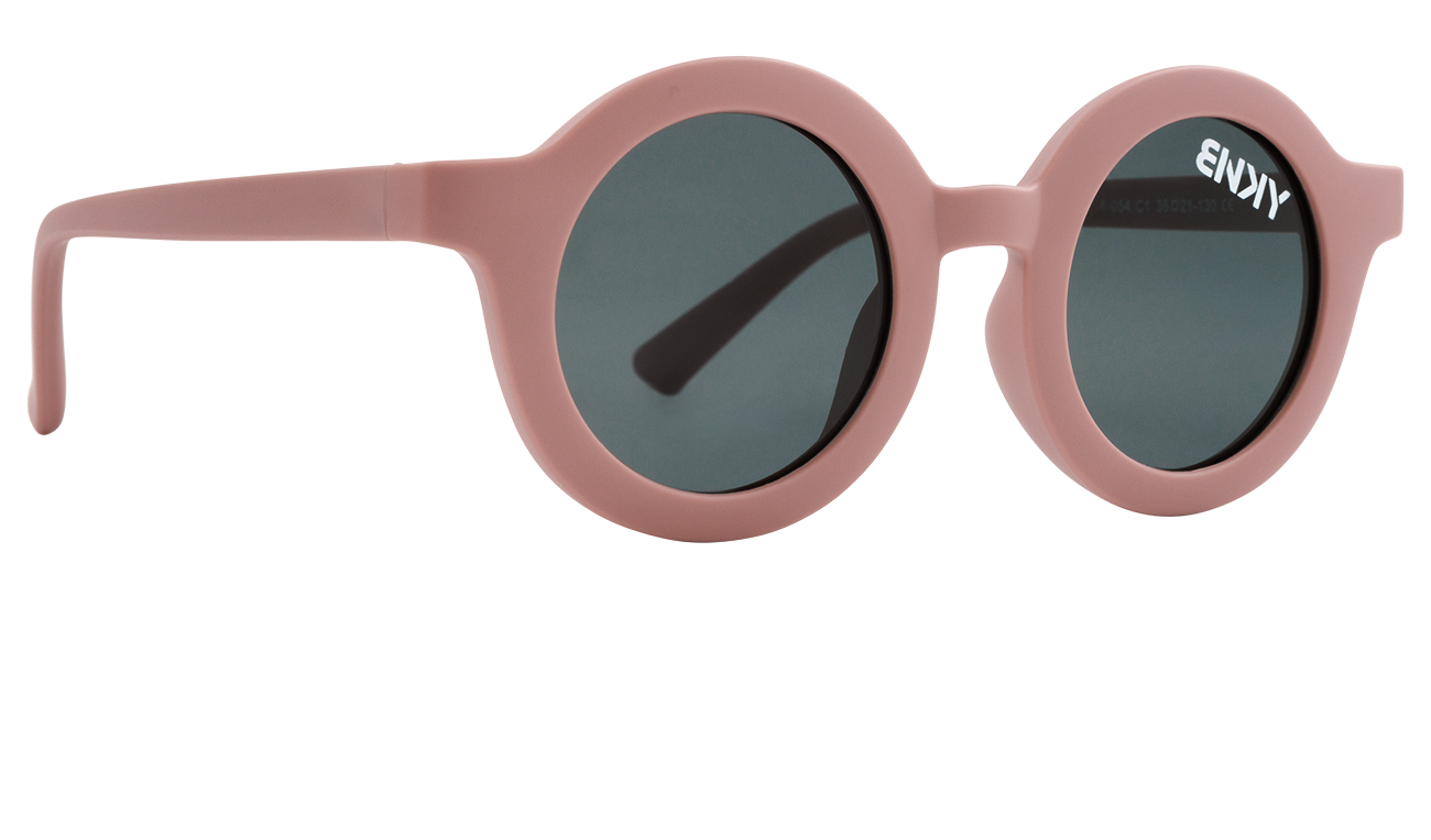 Vintage-inspired round sunglasses in soft pink with dark lenses, perfect for stylish sun protection. Ideal for kids.