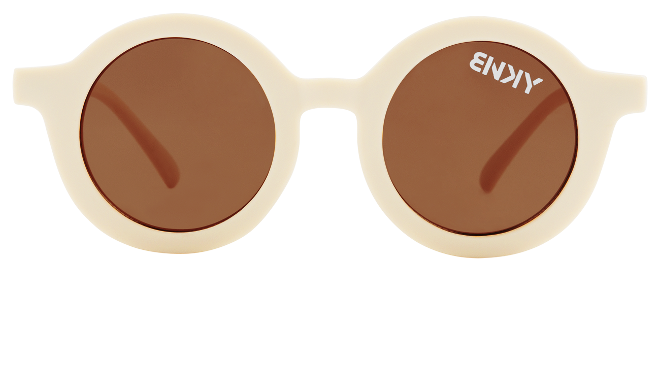 Stylish round sunglasses in a sand color with brown lenses, designed for infants and toddlers. Perfect for outdoor adventures.