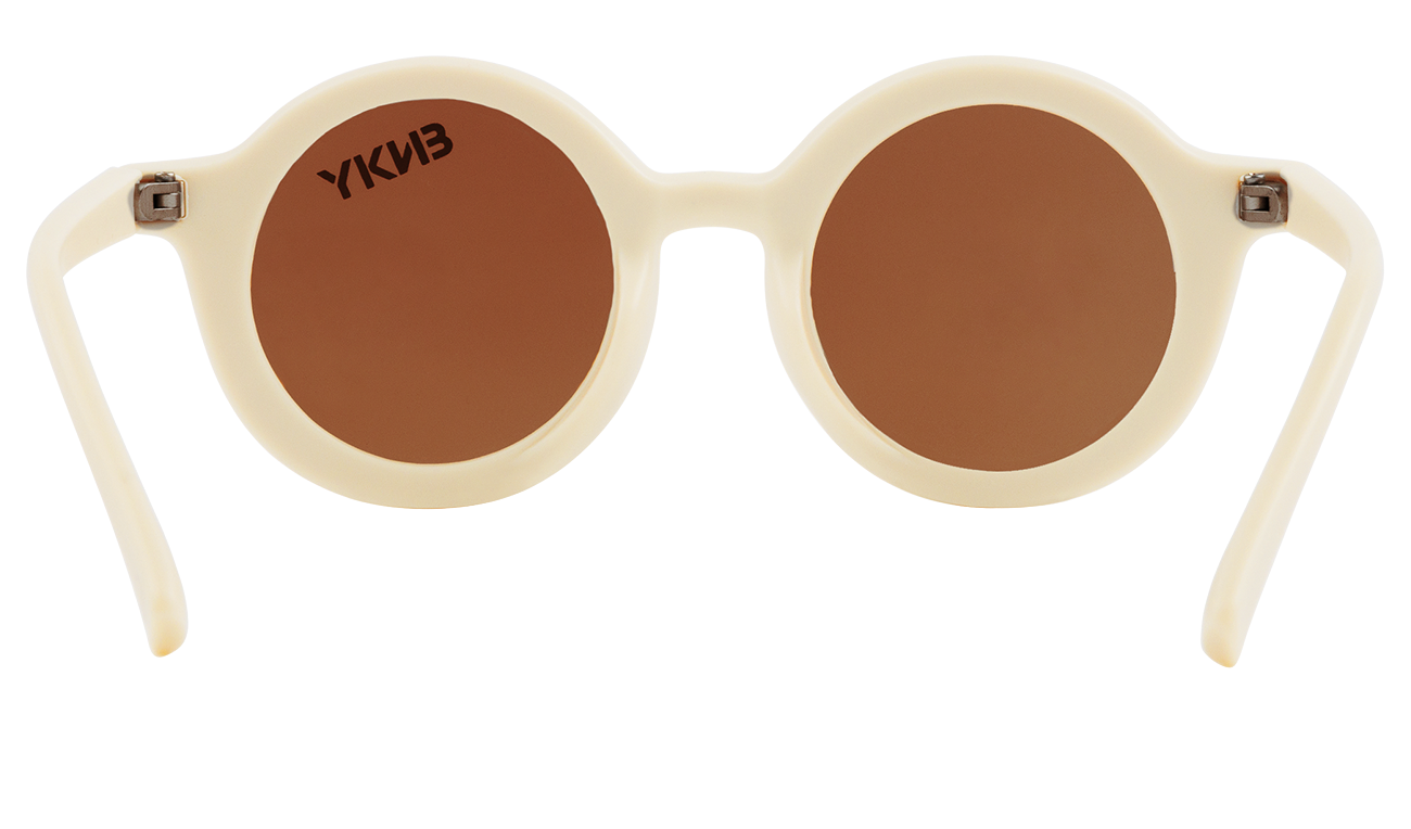 Stylish round sunglasses in a sand color with brown lenses, perfect for kids' outdoor adventures.