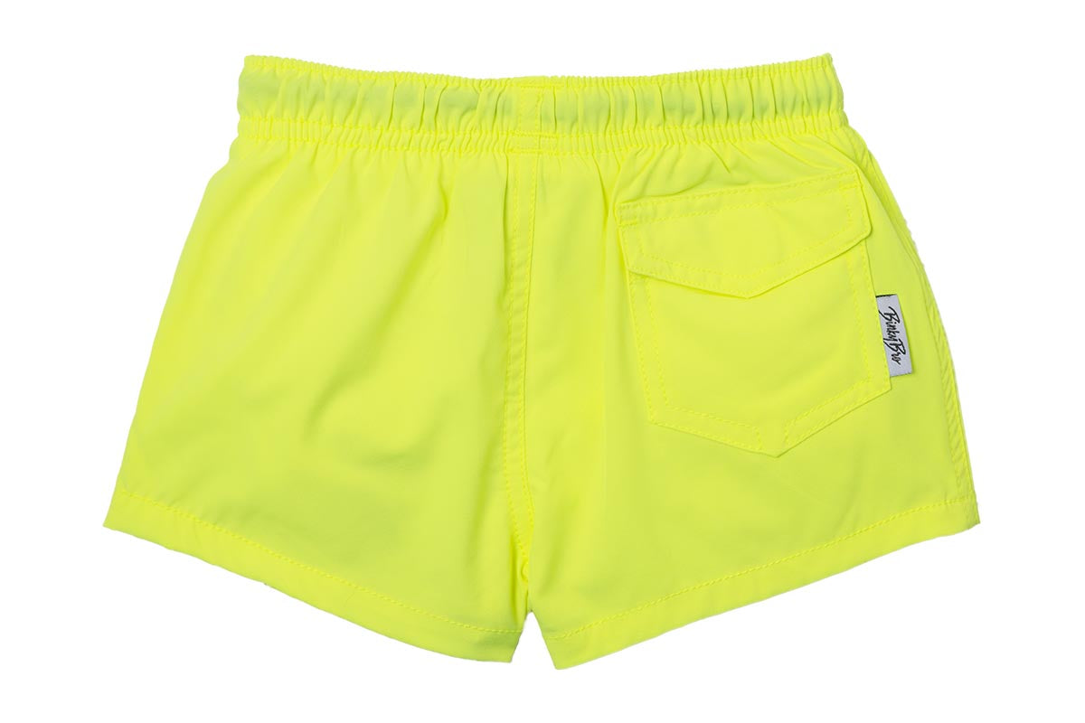 Bright yellow swim shorts with an elastic waistband and a back pocket, designed for active kids. Perfect for summer fun.
