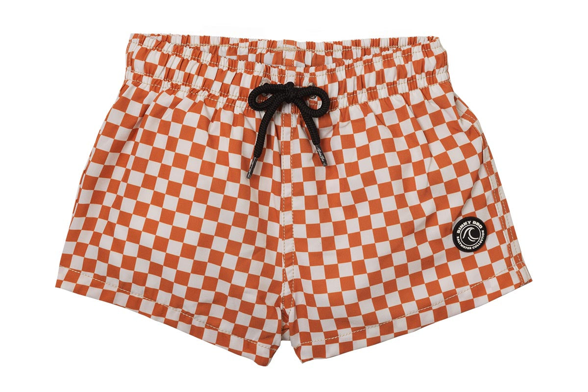 Orange and white checkered swim shorts with an elastic waistband and black drawstring, featuring a logo patch.