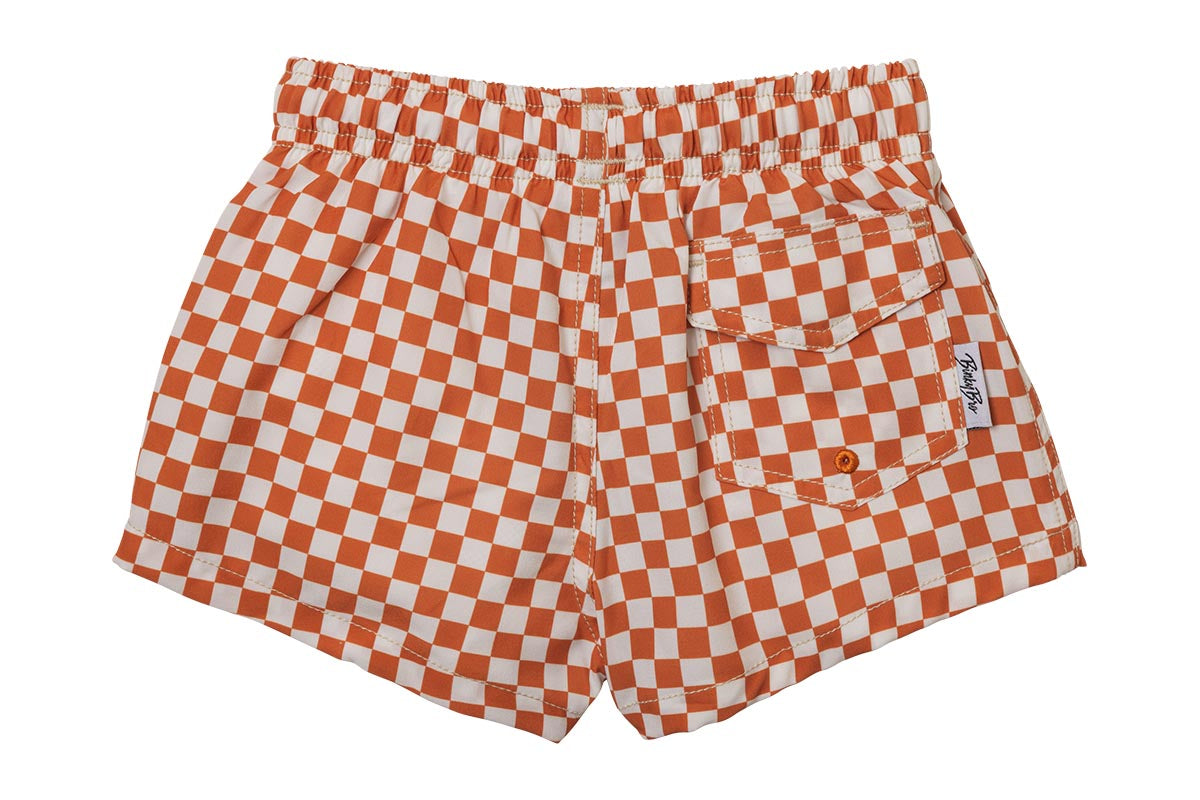 Orange and white checkered swim shorts with an elastic waistband and a back pocket, designed for kids.