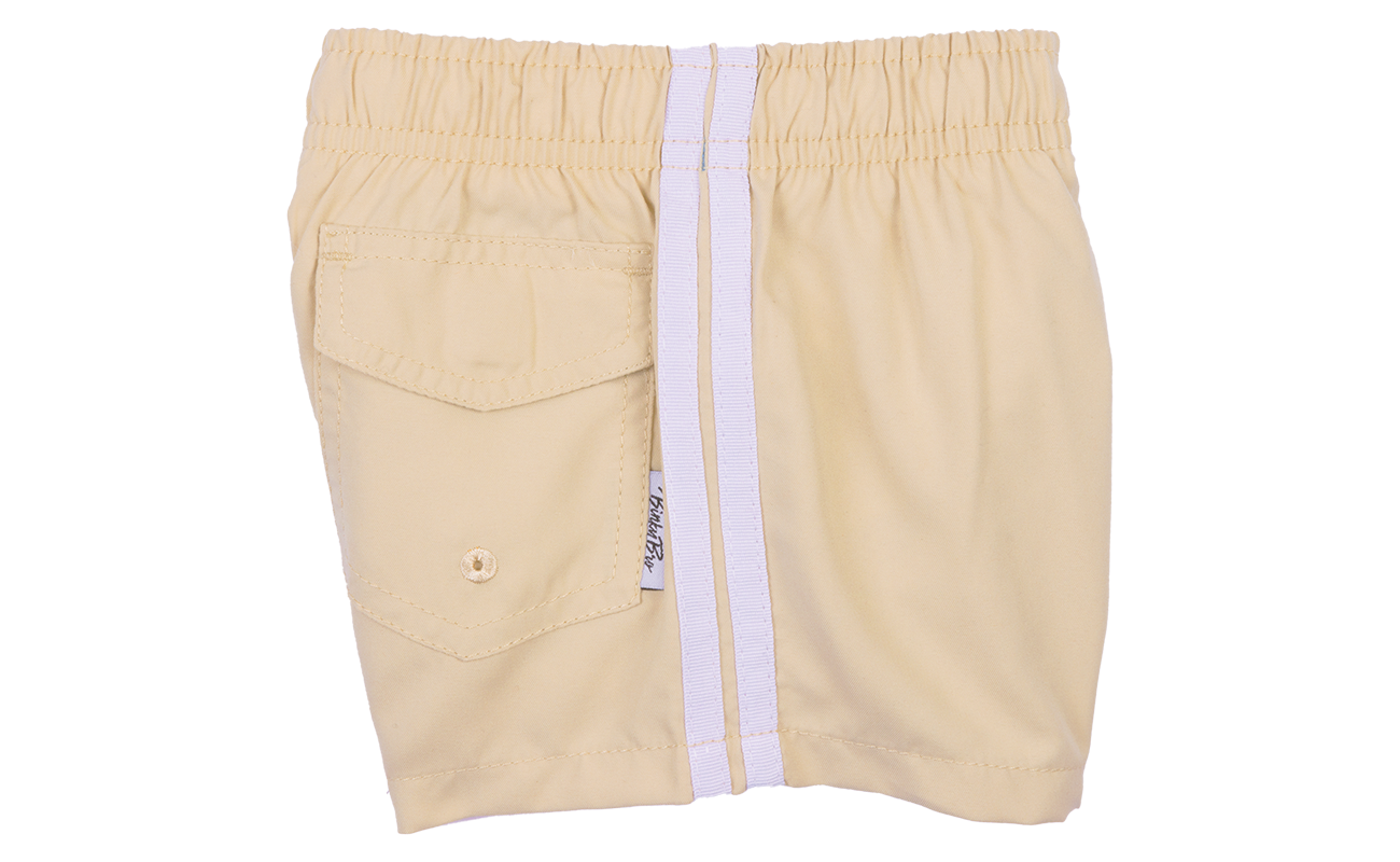 Light beige swim shorts for kids featuring an elastic waistband and a side pocket, perfect for beach or pool days.