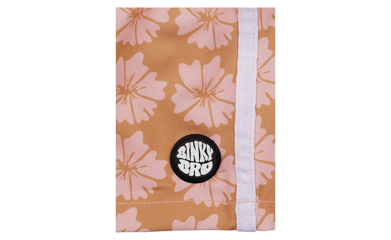 Close-up of the Tavaura Swimmie featuring a floral pattern in warm tones and a BinkyBro logo patch.