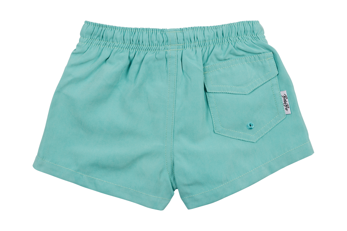 Teal and blue suede swim shorts featuring an elastic waistband and a back pocket, perfect for kids' summer fun.