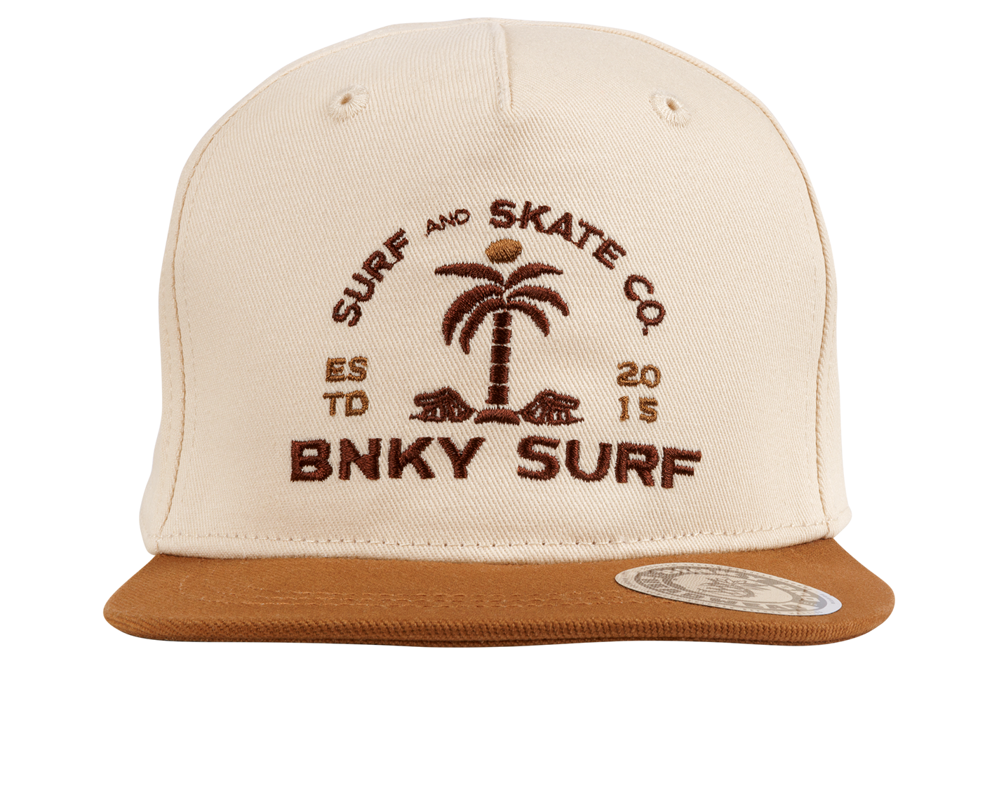 Cream snapback hat with brown leather visor featuring a palm tree and "BNKY SURF" logo, perfect for stylish kids.