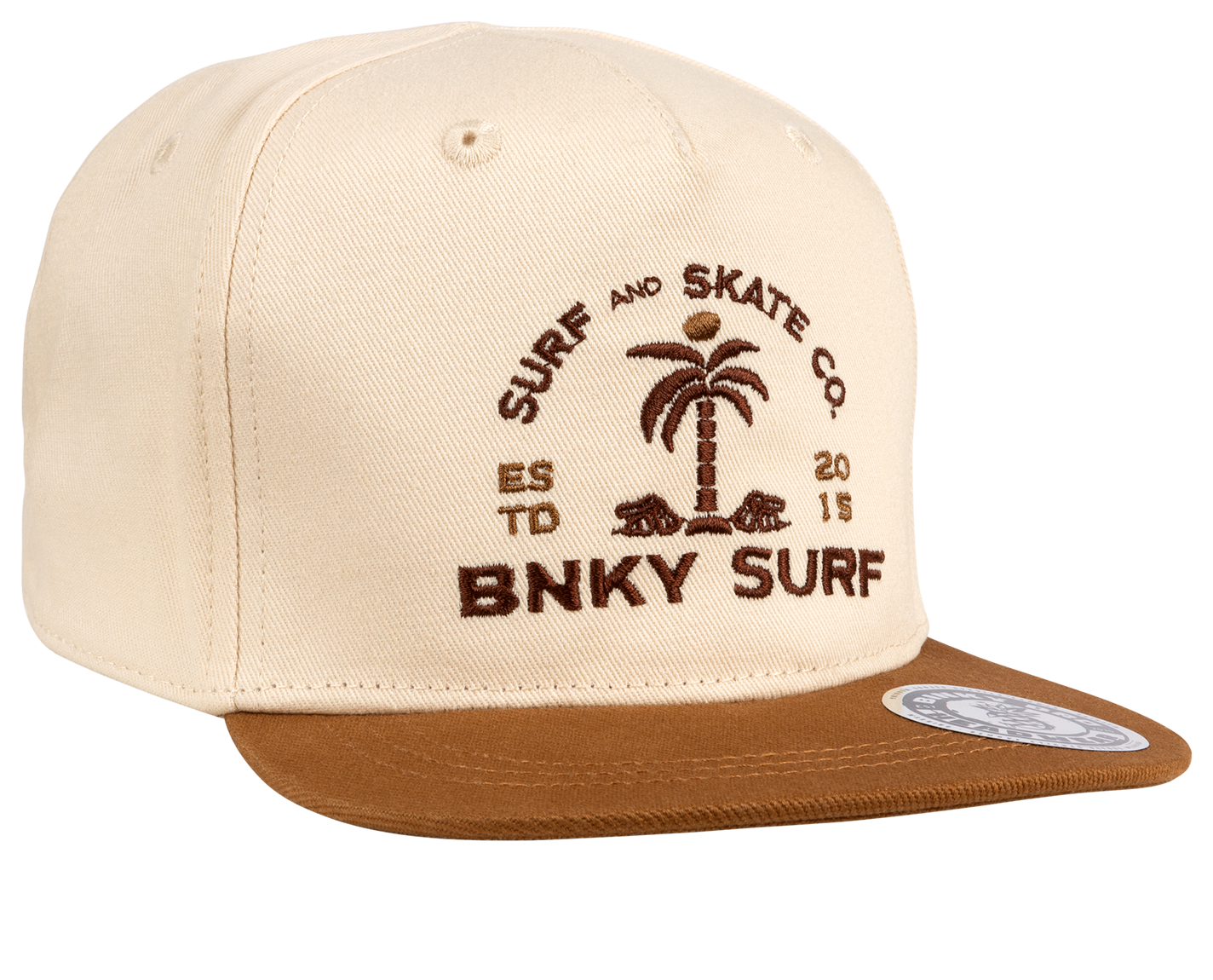 Cream snapback hat with brown brim featuring a palm tree logo and "BNKY SURF" text, perfect for young surf enthusiasts.