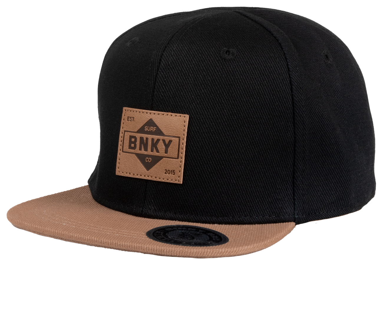Stylish black snapback hat with a tan brim and a BNKY logo patch, perfect for kids embracing a surf-snow-skate lifestyle.