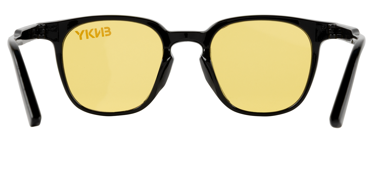 Stylish black-framed sunglasses with yellow lenses, perfect for a trendy look and UV protection. Ideal for outdoor adventures.
