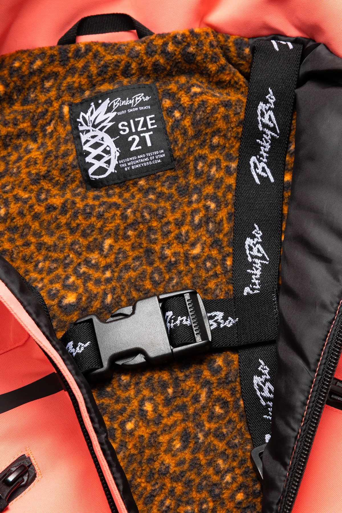 Inside view of the Roxy Georgia Peach jacket featuring a leopard print lining and adjustable strap, size 2T.