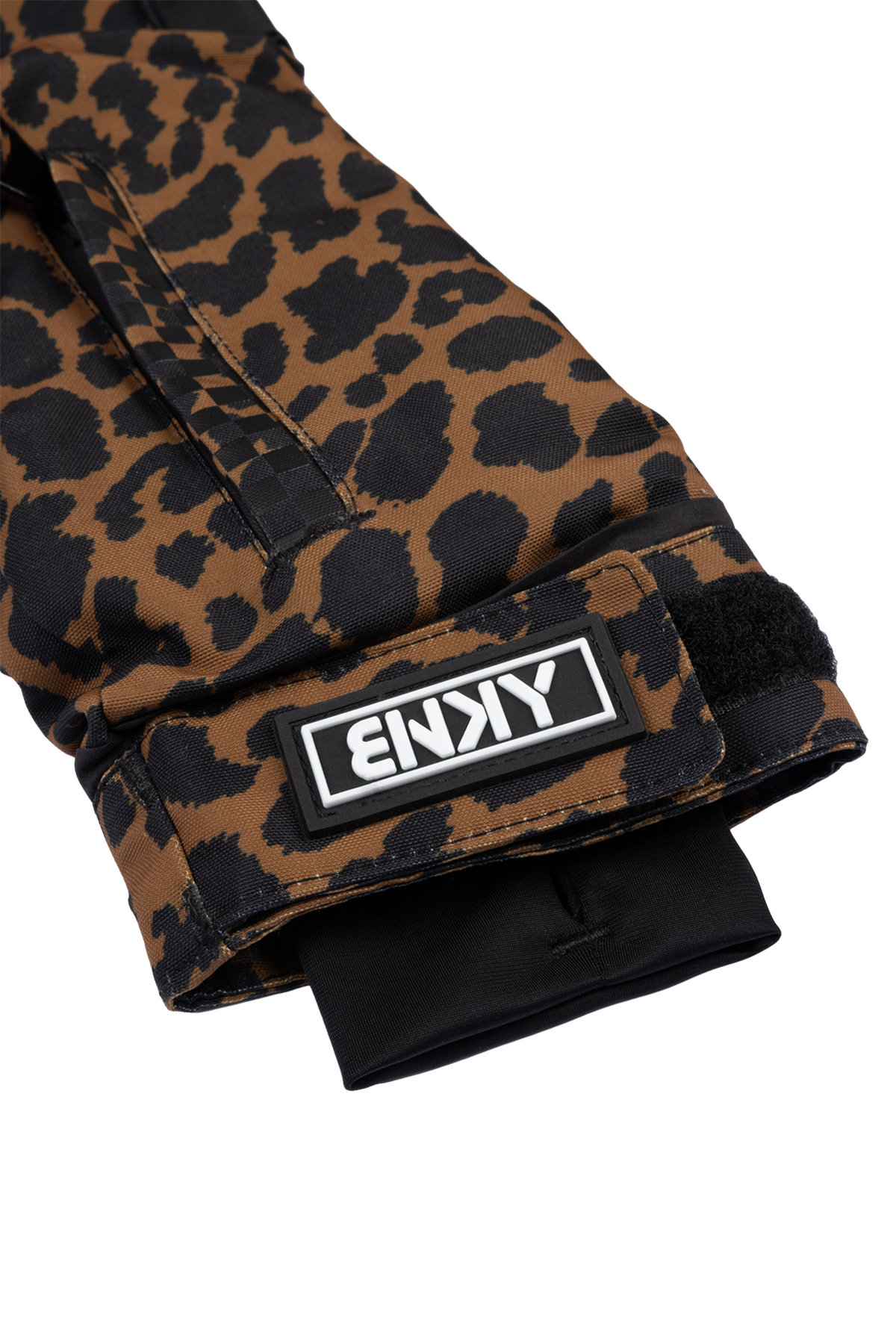 Stylish brown cheetah print sleeve of the 99-90 Roxy Cheetah glove, featuring a black logo patch and adjustable cuff.
