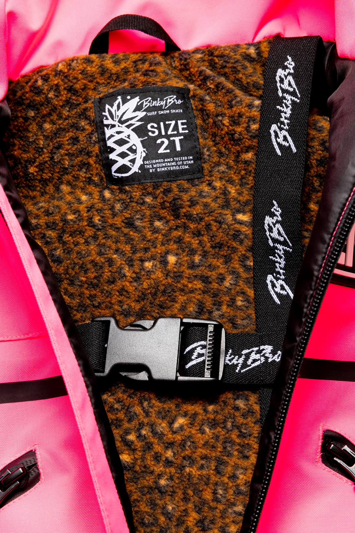 Interior view of the 99-90 BNKY Knockout Pink jacket showing a cozy lining and size tag for toddlers.