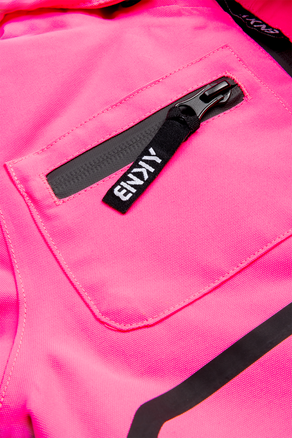 Bright pink fabric featuring a zippered pocket with a black pull tab, showcasing the stylish design of the BNKY Knockout Pink.
