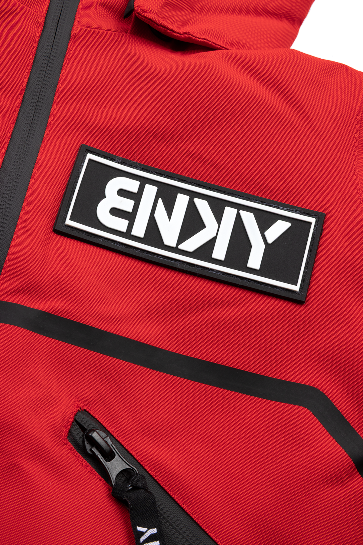 Red BNKY Imperial jacket featuring a prominent black logo patch and zippered pockets, designed for active youth.