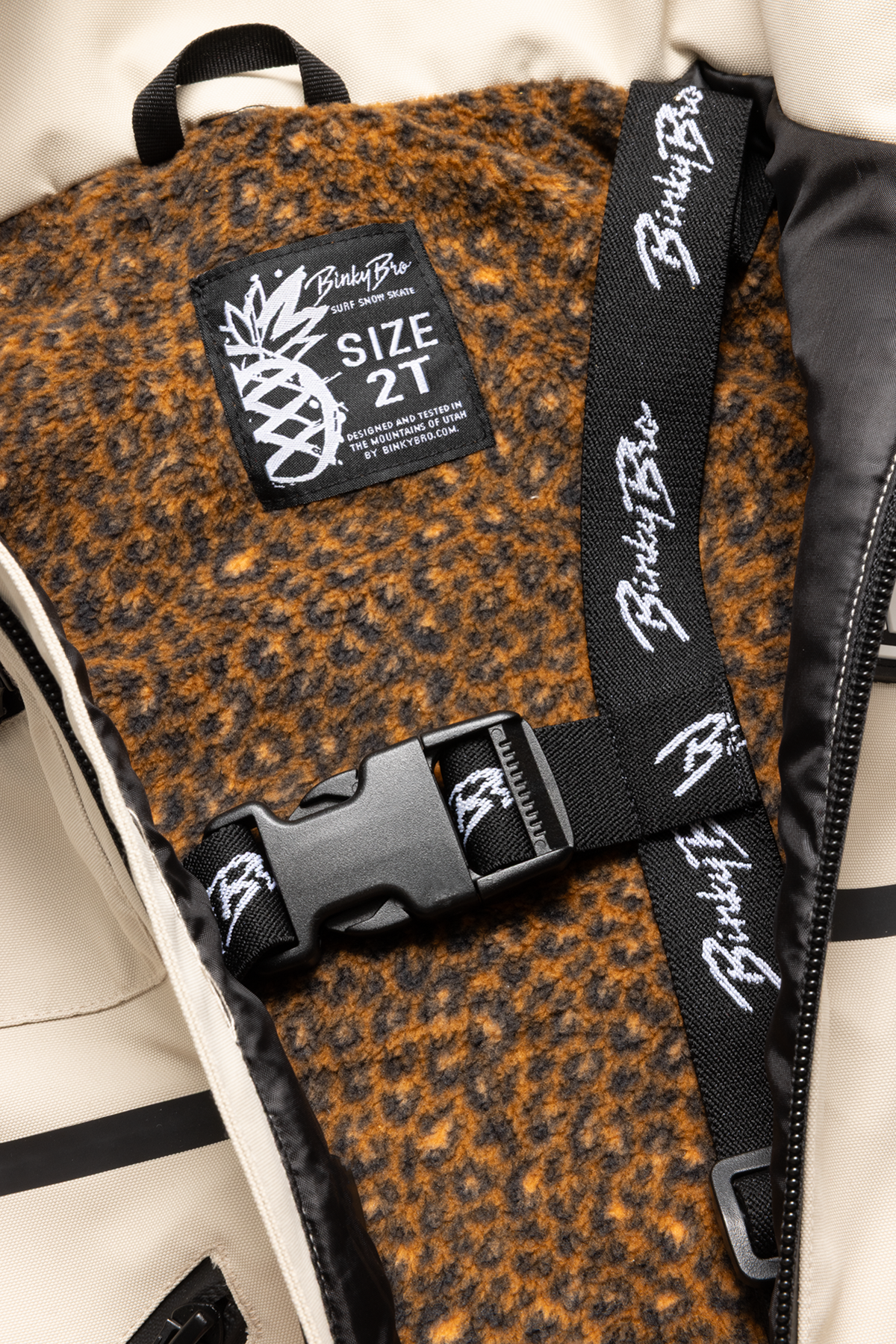 Interior view of the 99-90 BNKY Island Fossil jacket showing a size tag and a stylish, textured lining in warm tones.