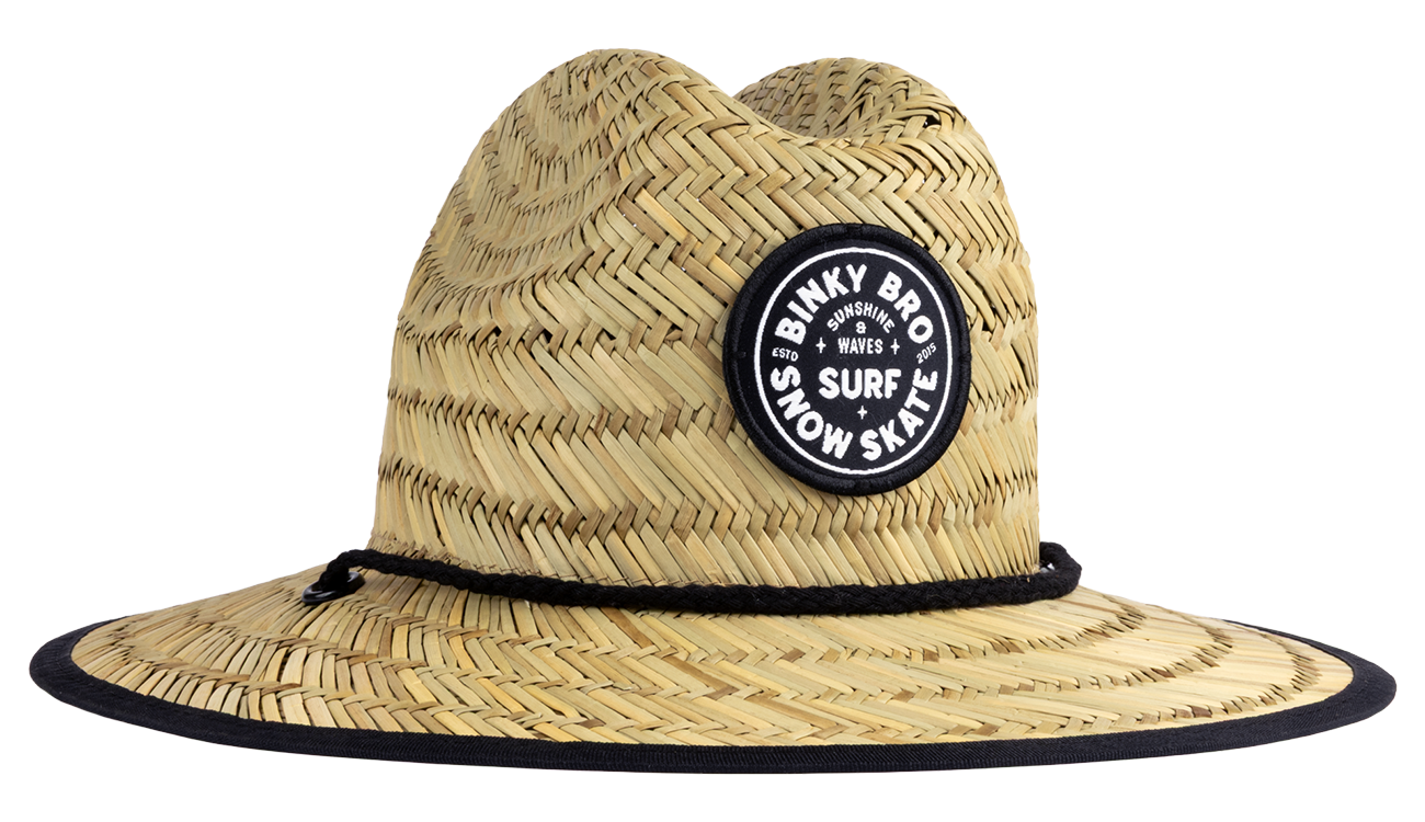 Stylish straw sun hat with a wide brim and a black logo patch, perfect for outdoor adventures in surf, snow, and skate.