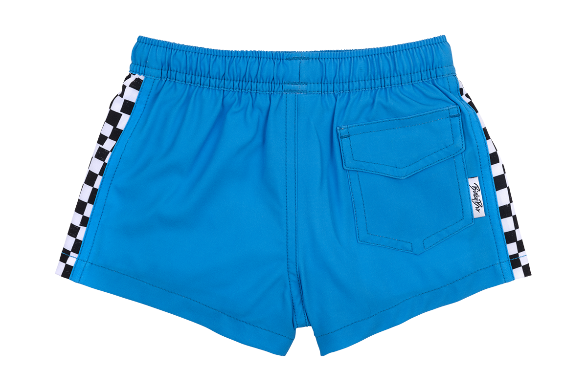 Blue swim shorts featuring a checkered side design and a back pocket, perfect for active kids. Stylish and functional.