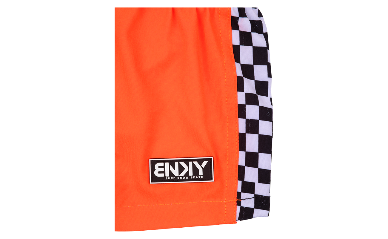 Bright orange shorts featuring a black and white checkered side panel and a branded patch, perfect for active kids.