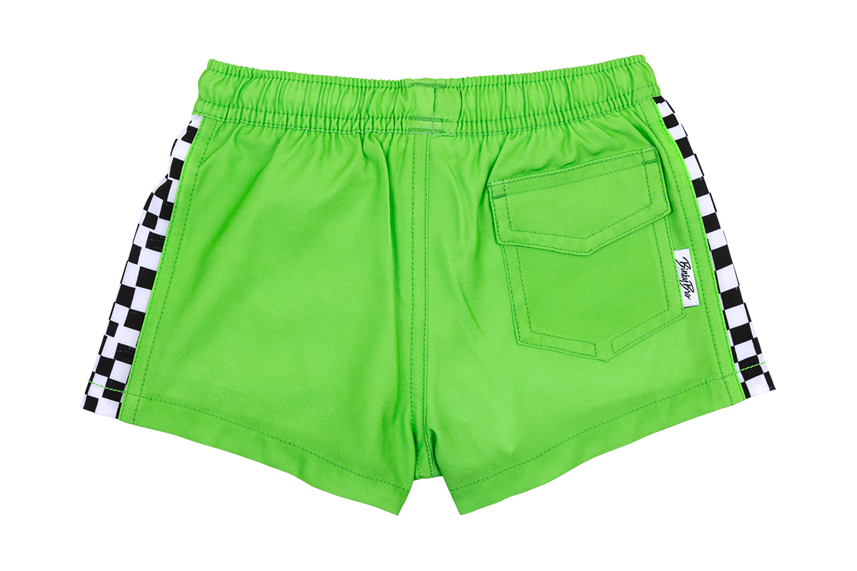 Bright green swim shorts featuring black and white checkered side panels and a back pocket, perfect for active kids.