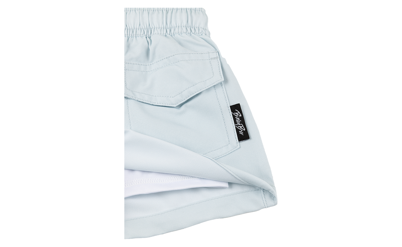 Light blue Lyon 25 shorts featuring an elastic waistband and a side pocket, designed for infants and toddlers.