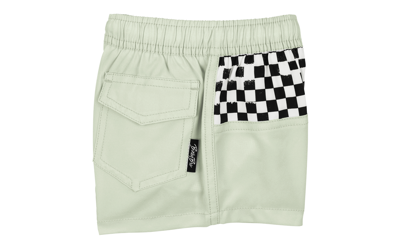 Light green shorts featuring a checkerboard pocket design, perfect for stylish kids' summer wear. Ideal for active play.