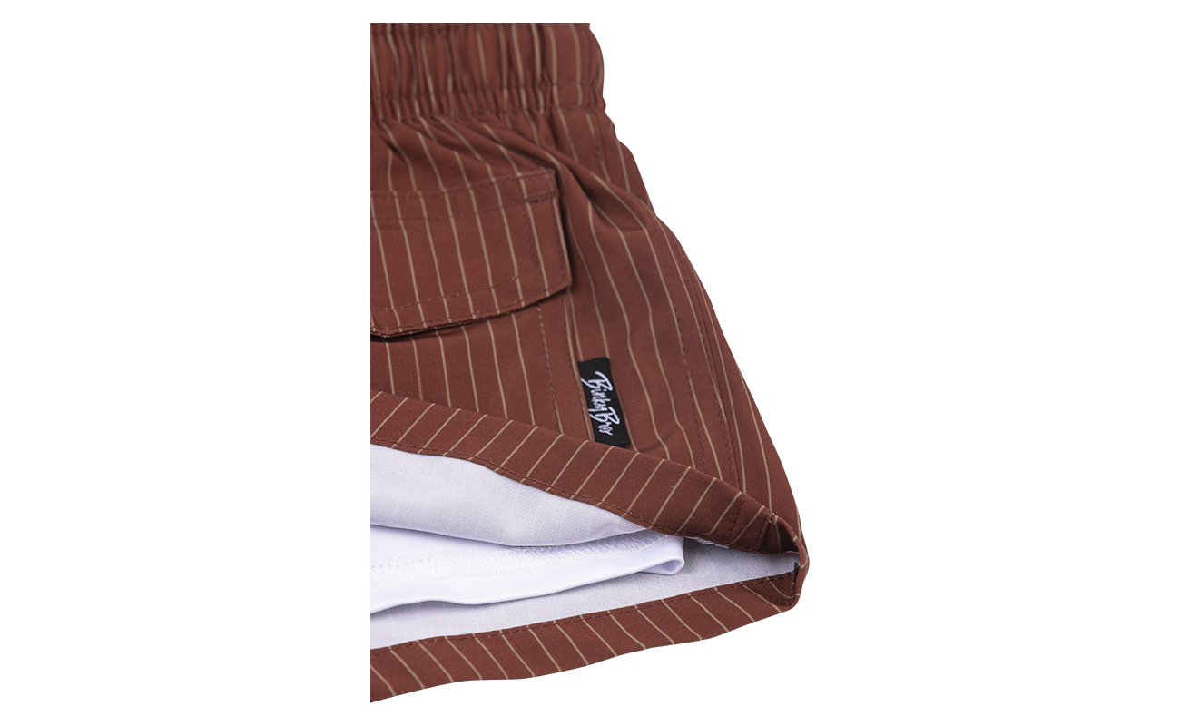 Stylish brown striped shorts with a pocket and BinkyBro label, designed for kids' surf-snow-skate lifestyle.