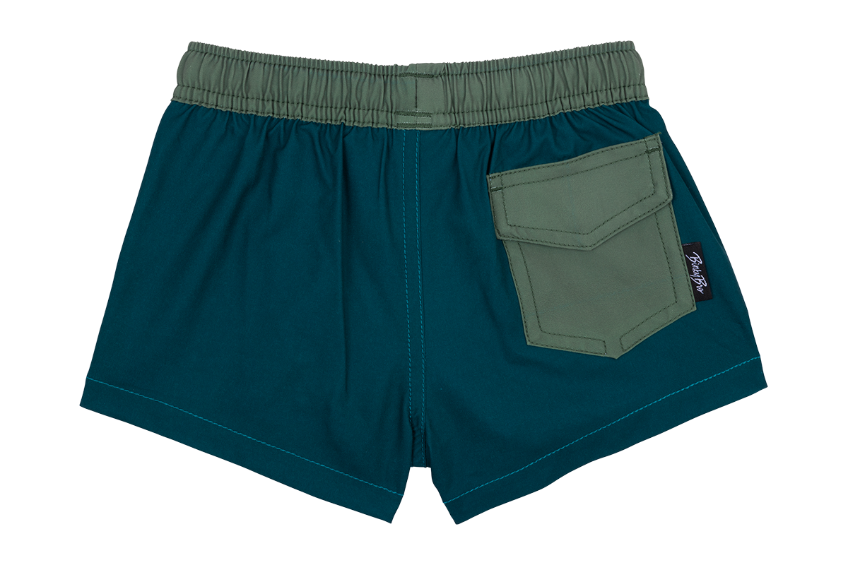 Stylish green swim shorts with an elastic waistband and a back pocket, perfect for active kids. Ideal for summer fun.