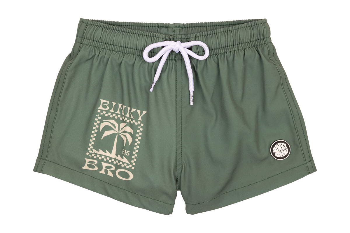 Stylish green swim shorts for kids featuring a palm tree graphic and BinkyBro logo, perfect for summer adventures.