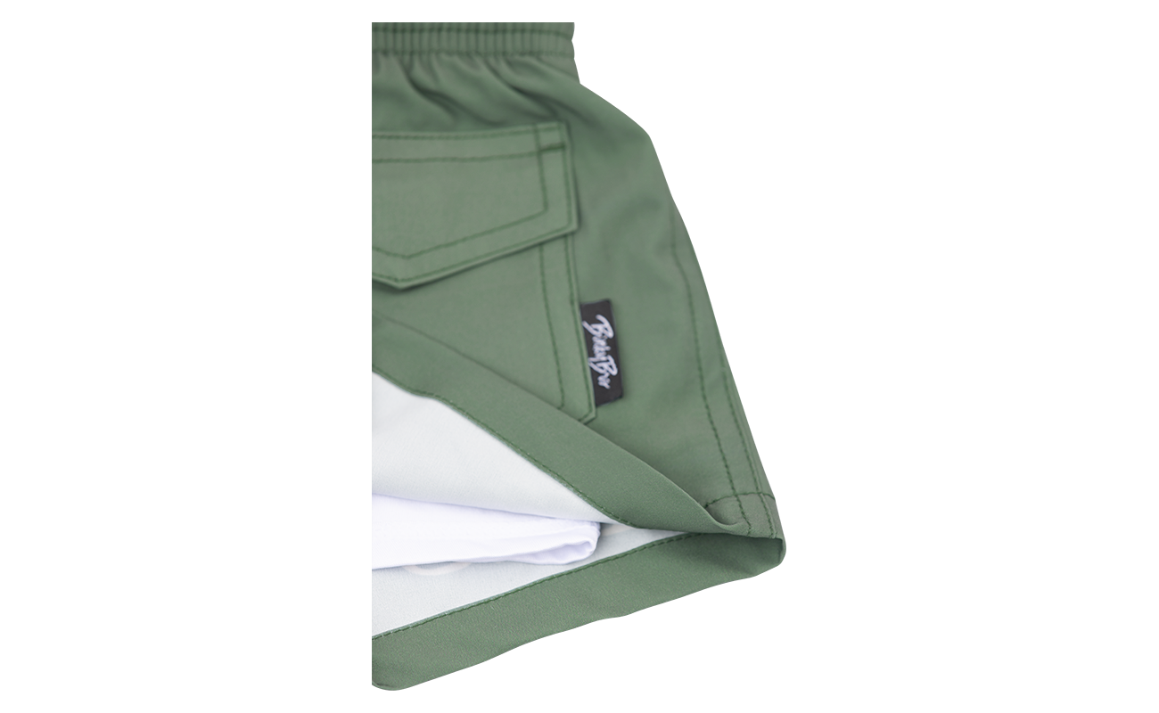Stylish green Hubba Hideout shorts with a white lining, designed for active infants and toddlers. Perfect for outdoor adventures.