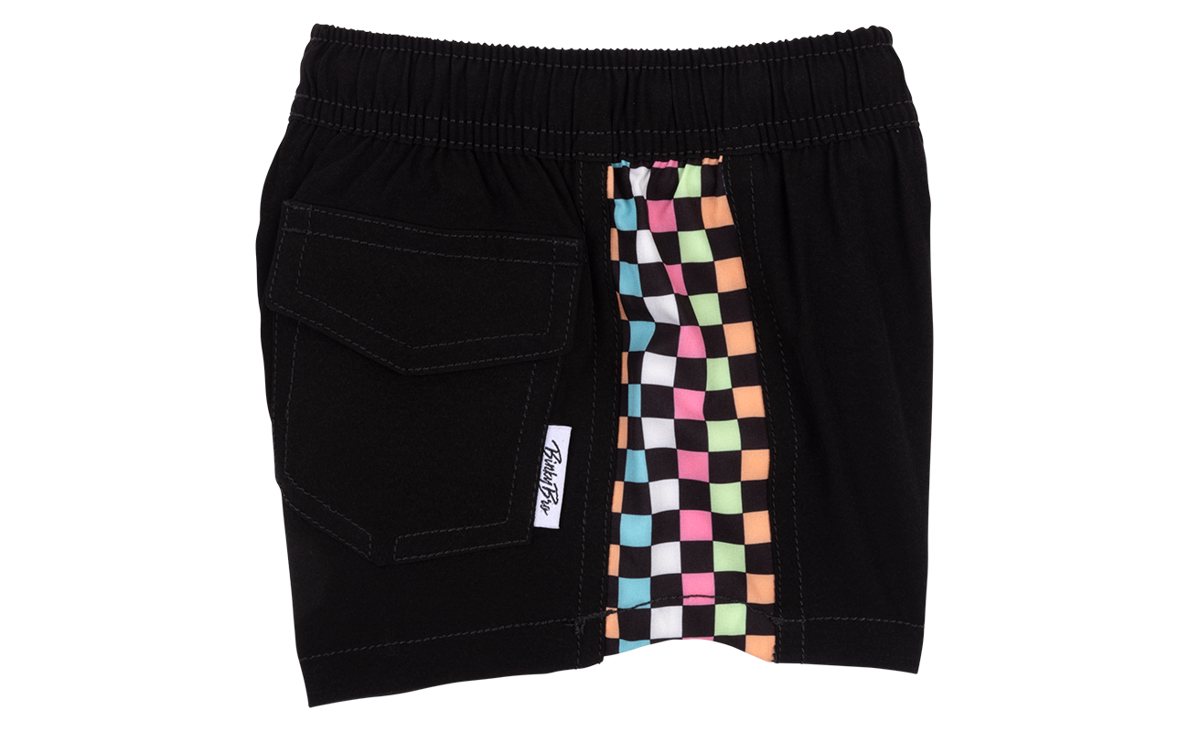 Stylish black shorts featuring a colorful checkerboard side panel and a back pocket, perfect for active kids.