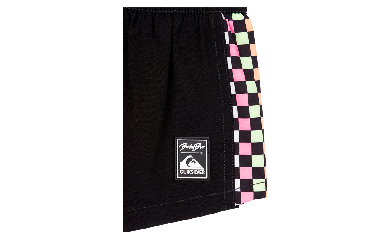 Stylish black shorts featuring a checkerboard design and logo, perfect for active kids embracing surf and skate culture.