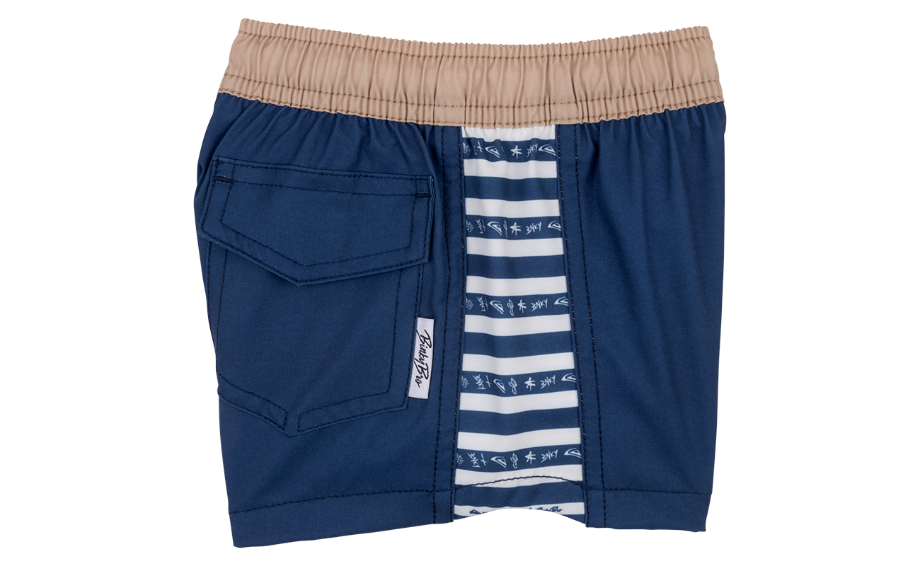 Stylish navy swim shorts with a tan waistband and striped inner lining, designed for active kids. Perfect for beach days.