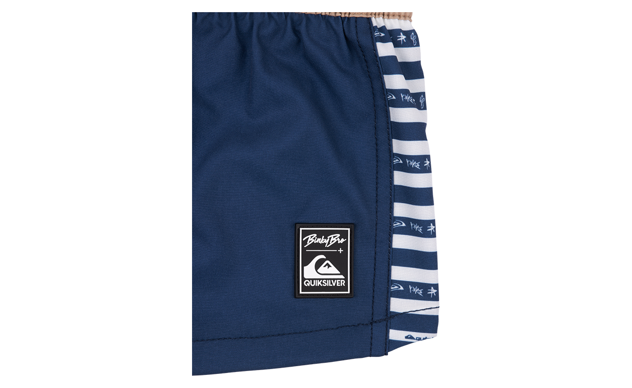 Stylish navy swim shorts featuring a striped side panel and BB x Quik branding, perfect for active kids.