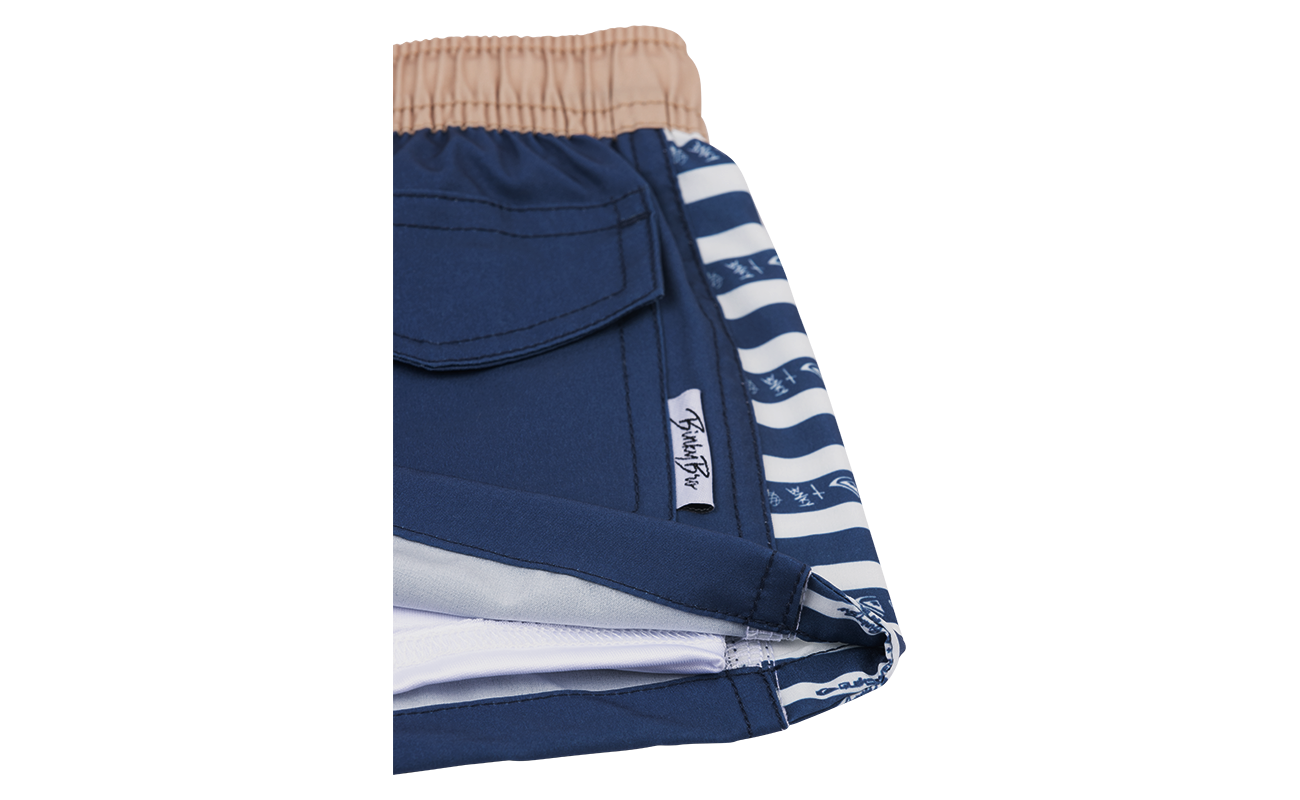 Stylish navy blue shorts with a tan waistband and striped pocket detailing, perfect for active kids.