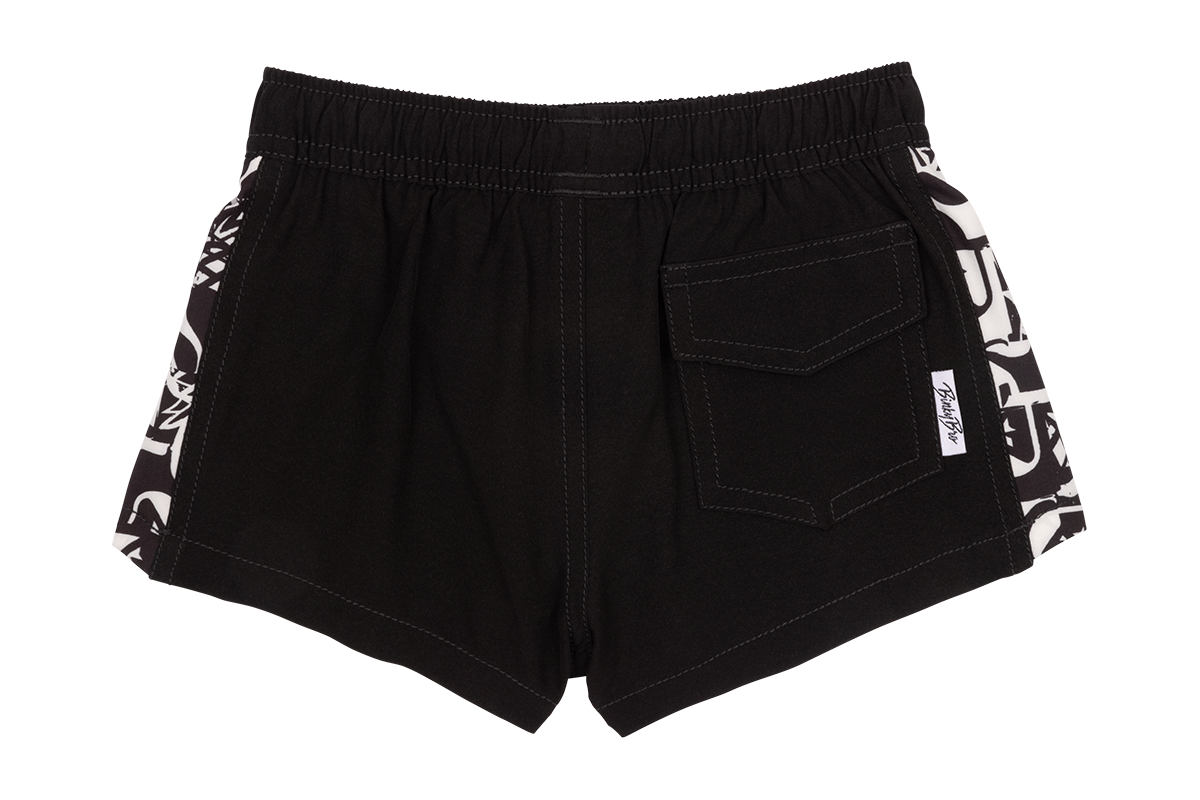 Black swim shorts featuring a stylish design with white accents on the sides, perfect for kids' summer adventures.