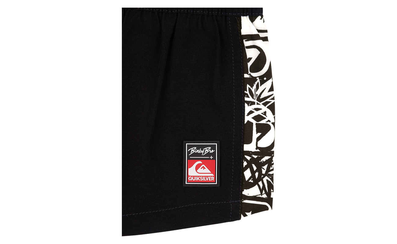 Black swim shorts featuring a bold white graphic and a Quiksilver logo, designed for stylish beach outings.