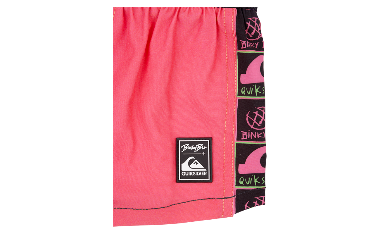 Stylish pink swim shorts featuring BinkyBro and Quiksilver branding, perfect for active kids. Ideal for beach or pool days.