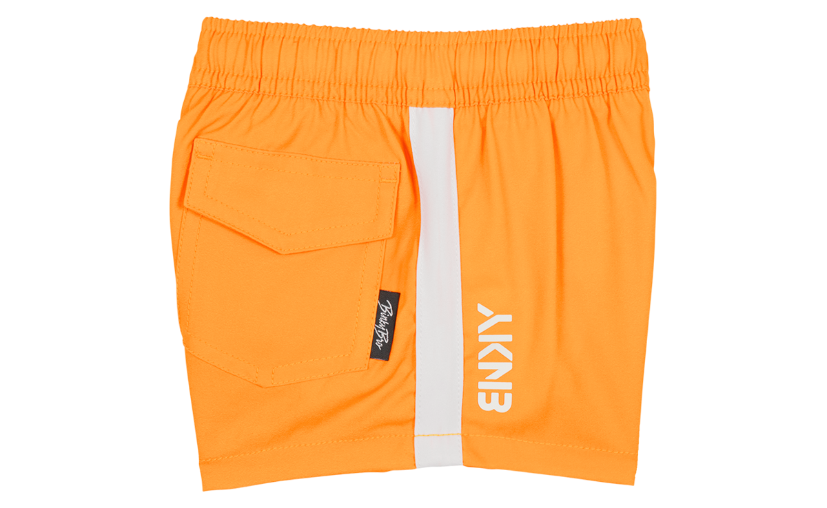 Bright orange toddler shorts featuring a side stripe and a back pocket, designed for active play and stylish comfort.