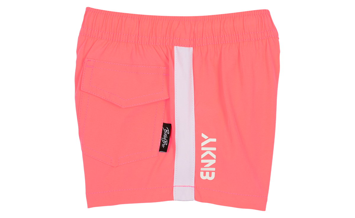 Blaze Coral swim shorts featuring a side pocket and bold branding, perfect for active kids enjoying the outdoors.