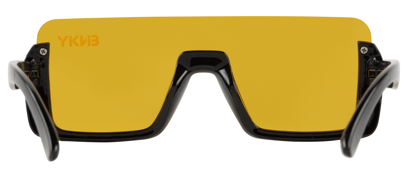 Stylish yellow sunglasses with a bold black frame, designed for a sporty look and UV protection. Perfect for outdoor adventures.