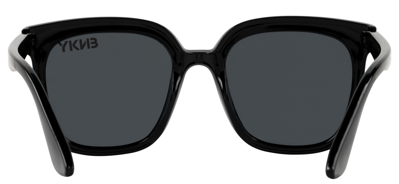Stylish black sunglasses with a modern design, featuring dark lenses and sleek frames, perfect for outdoor adventures.