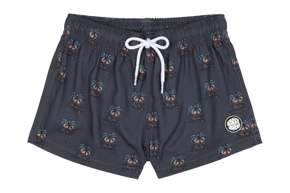 Stylish swim shorts featuring a palm tree print, perfect for kids who love a surf-snow-skate lifestyle.