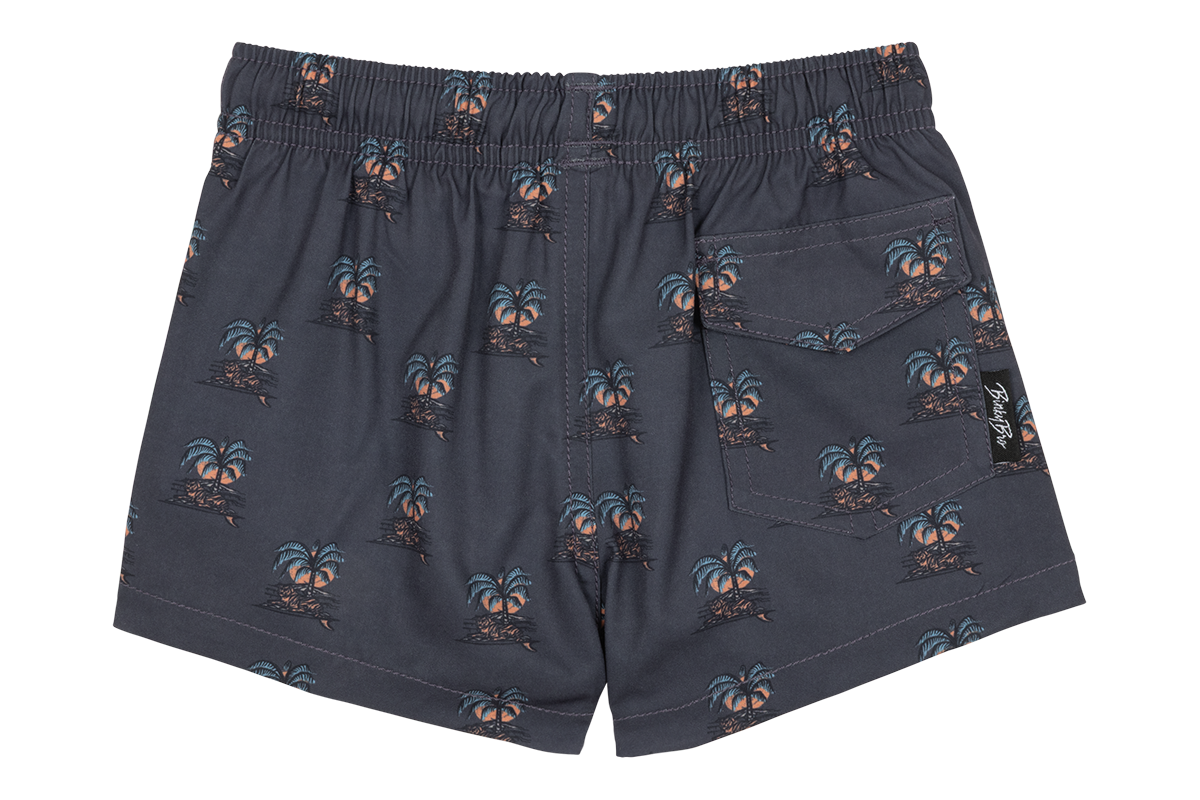 Stylish swim trunks featuring a palm tree print, perfect for kids who love a surf-snow-skate lifestyle.